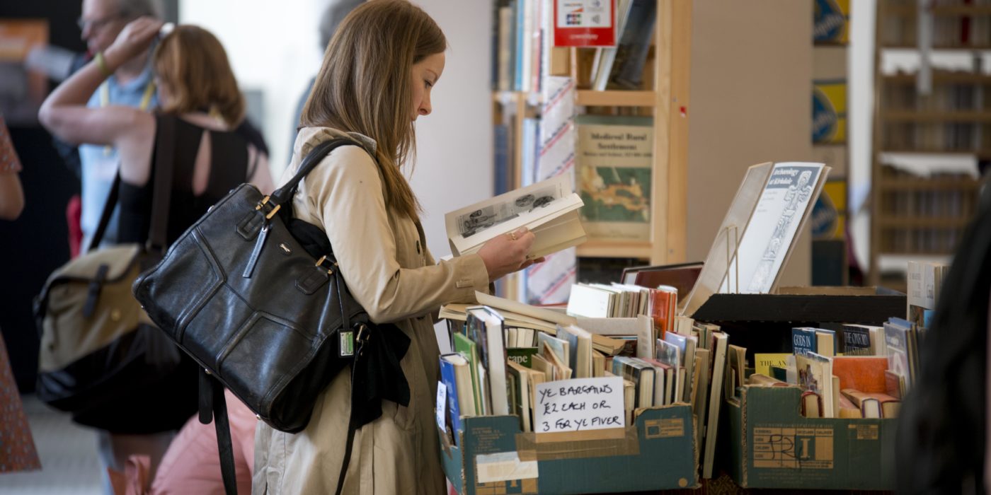 Delegate leafing through the Second-Hand Bookfair at IMC 2017