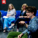 delegates listening to a presenter at IMC 2019