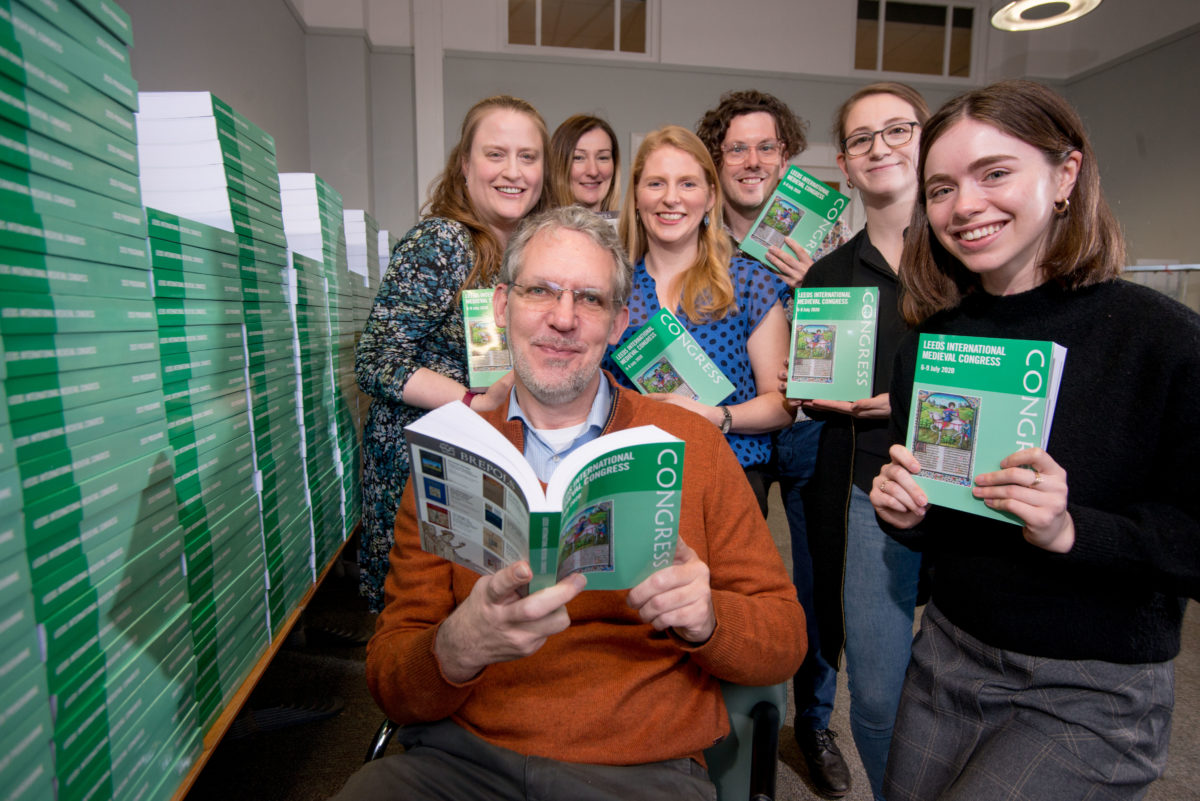 The IMC Team with the 2020 Programme Book.