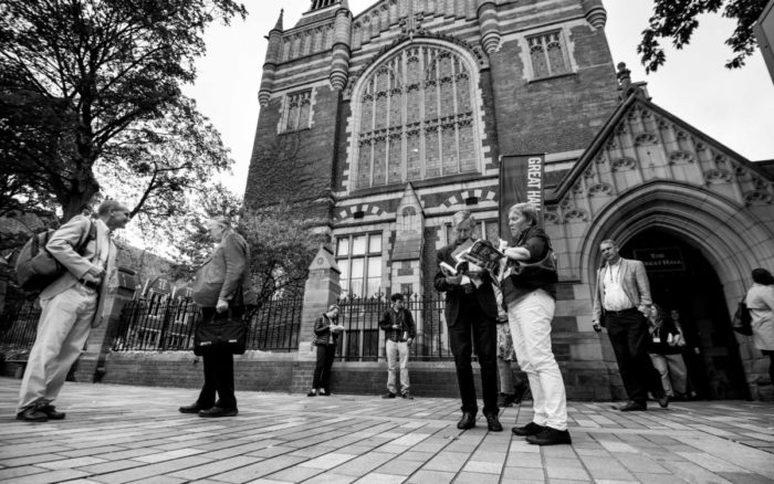 black and white photograph of delegates outside the Great Hall during IMC 2019