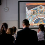 A speaker presenting at IMC 2019