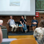 A panel discussion during IMC 2019