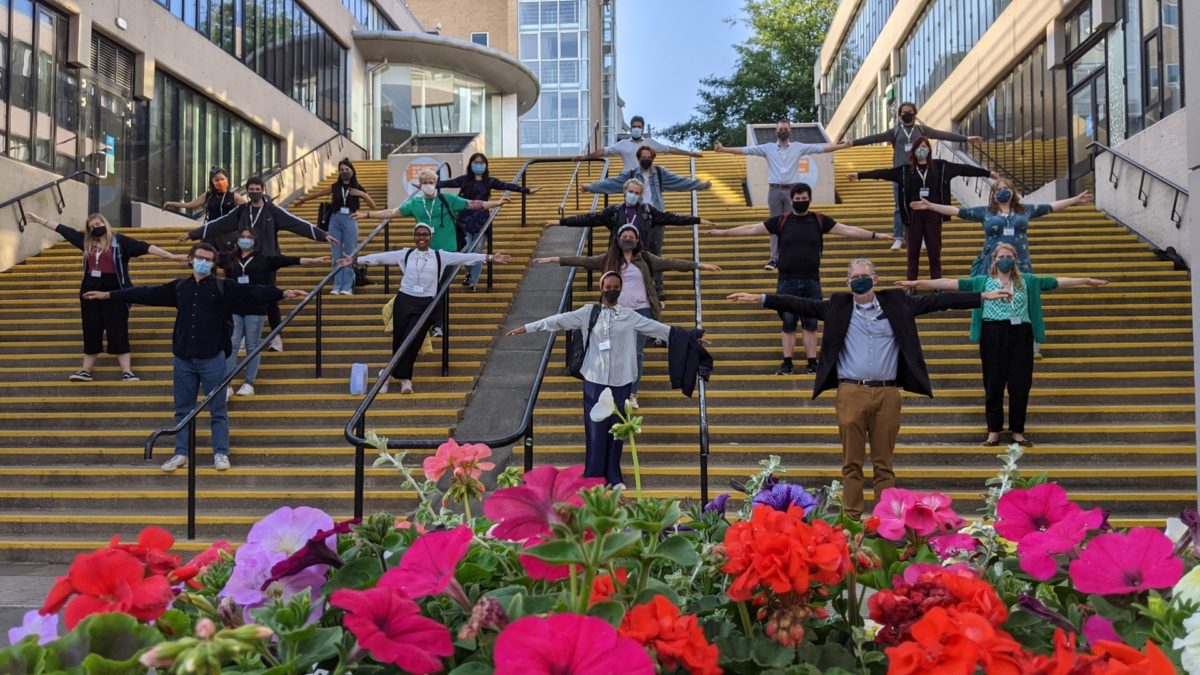 Socially distanced group shot of the IMC team following IMC 2021