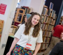 Sharna, Congress Officer, in front of the Second Hand and Antiquarian Bookfair during IMC.
