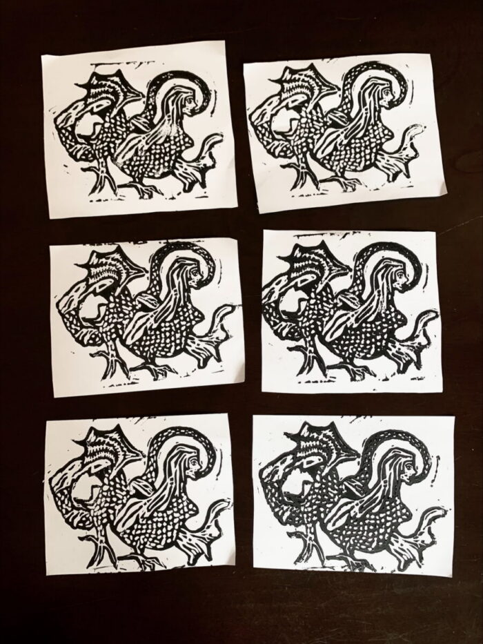 Black and white linocut.